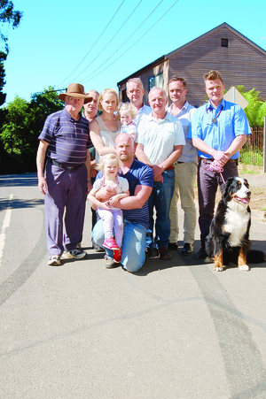 Steve Griffiths, Gembrook IGA owner Andrew Spark, Bobby Gordon and Gembrook veterinarian Tom Cook with Ruby. Bob Farr is the station master for Puffing Billy, Carrie Gordon with Sophia, Robert Gordon and Sam Gordon in the front row with Abby.