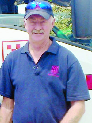 Career firefighter Peter Cramer will be sadly missed by the hills area he served for more than a decade. He is pictured here receiving a CFA long-service medal. Picture: Supplied by DSE