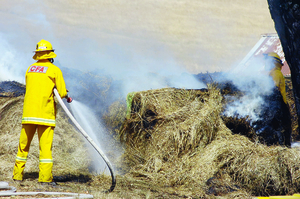 Firefighters worked for hours to ensure a hay bale fire did not spread last Thursday.