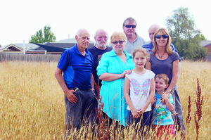 In the back row Doug Harlow, Glen James, Martin Knox and Ron Bowman. In the front row Carol James with Caroline Knox kids Emily and Riley. The Beaconsfield residents want this vacant block of land cleared. 92995