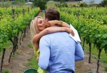 On one knee in winery backdrop