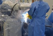 Robot and surgeons work side by side